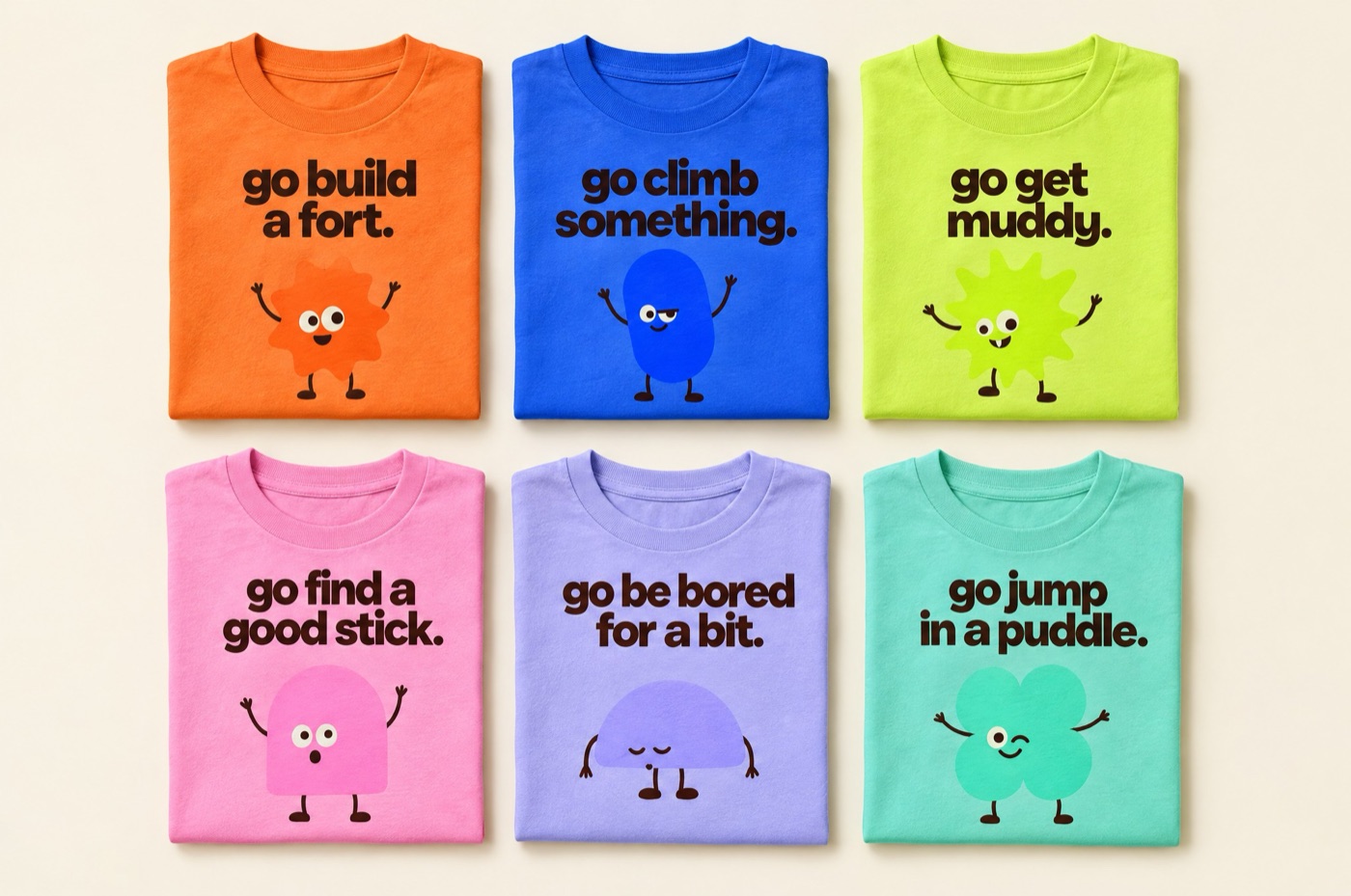 Six folded kids tees in the six gang colours, each with a go line like go build a fort